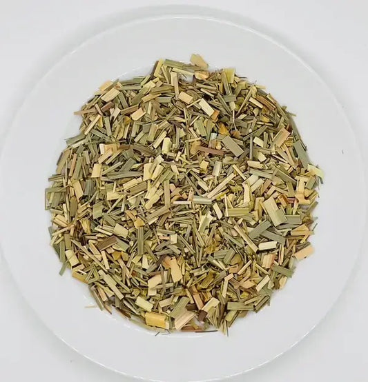 Organic lemongrass and ginger leaves, a vibrant herbal blend, perfect for a refreshing and revitalising tea experience. A natural infusion for wellbeing.