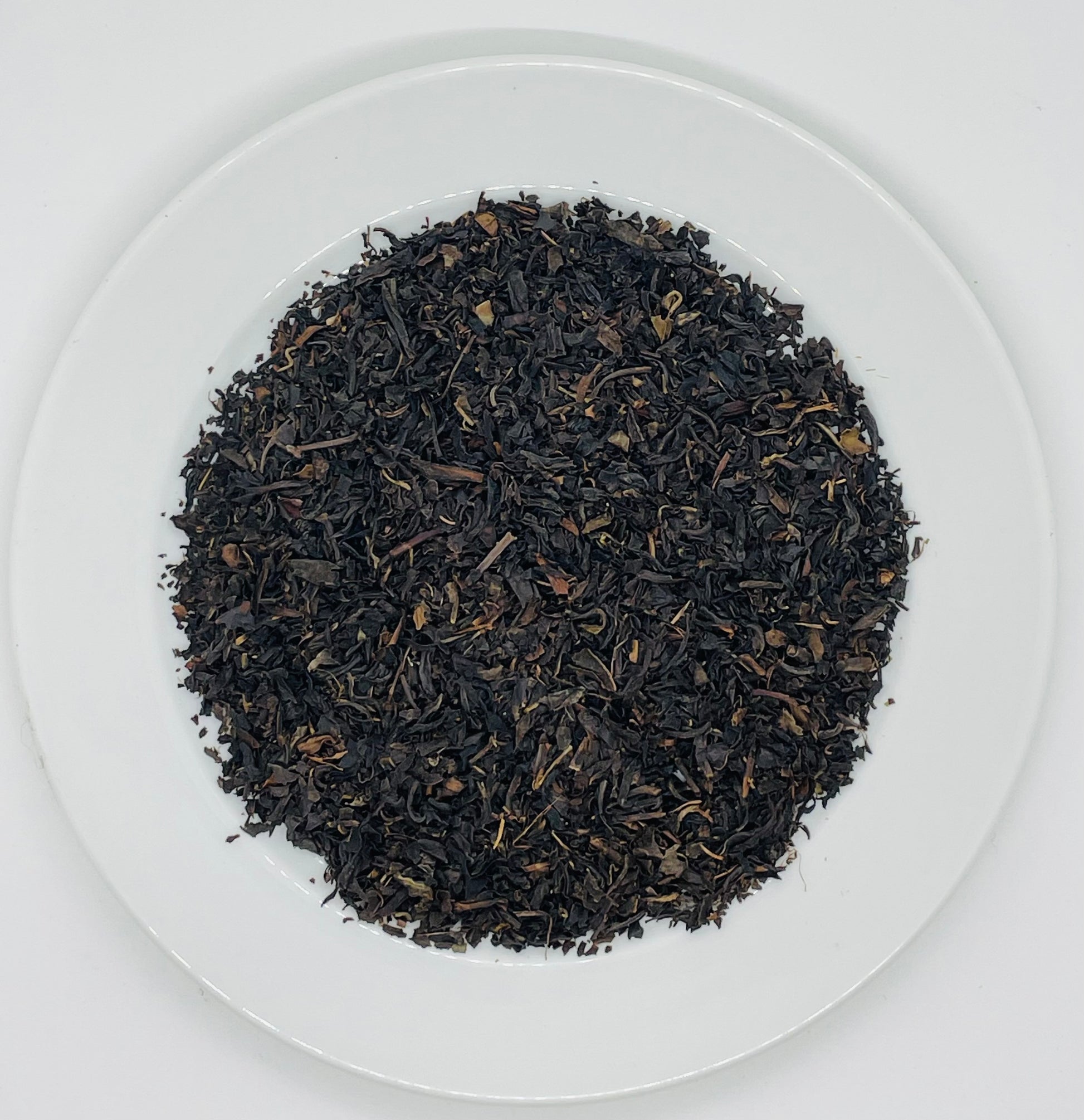 Leaves of freshly dried organic black tea blend. 